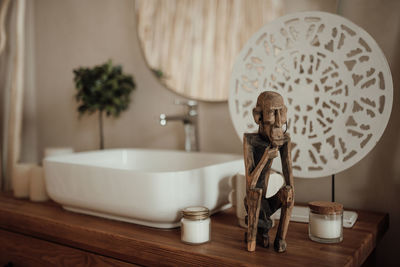 Luxury interior of big bathroom at modern african style with oval bathtub in natural lighting