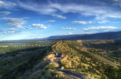 High angle view of field and mountain against sky