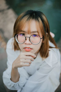 Close-up portrait of young woman wearing mask