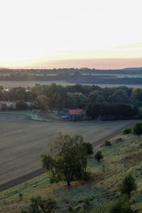 Scenic view of landscape against sky during sunset