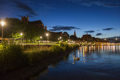 Illuminated buildings in city at night