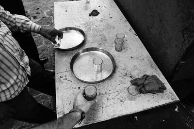 High angle view of man working on metal