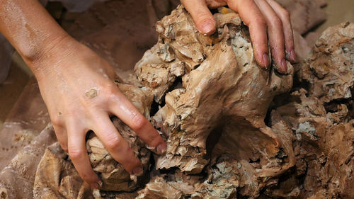 Low section of man holding hands