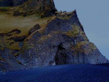 Low angle view of rock formations against sky