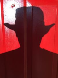Close-up of shadow on red wall
