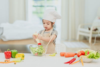 Midsection of woman preparing food on table