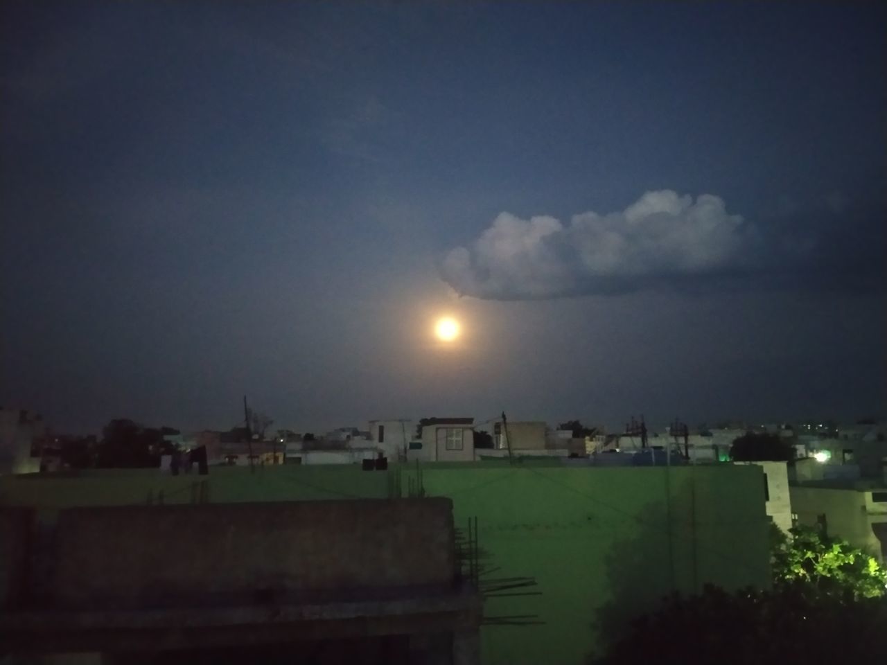 PANORAMIC VIEW OF BUILDINGS AGAINST SKY AT NIGHT