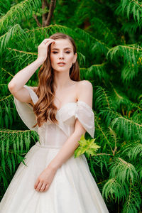 Beautiful young woman in a plant