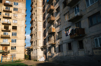 Low angle view of buildings against sky in city