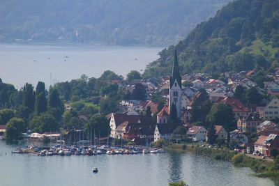 Scenic view of river by buildings in city