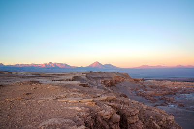 Scenic view of atacama desert against clear sky during sunset