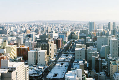 Aerial view of cityscape against clear sky