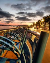 Scenic view of city against sky at sunset