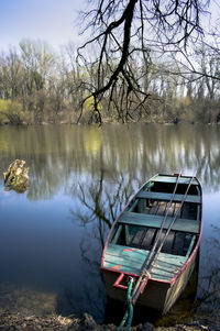 Boat moored in lake