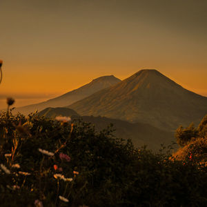 Scenic view of mountains against sky during sunset