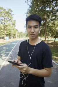 Portrait of young man using mobile phone