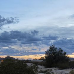 Scenic view of landscape against cloudy sky