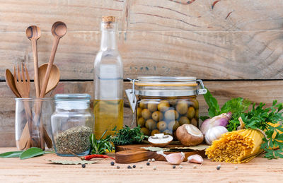 Close-up of raw pasta and various ingredient on table