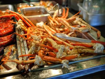 Close-up of crabs in container for sale in market