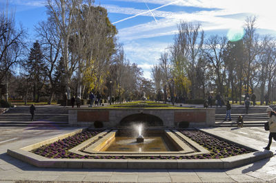 Fountain in park against sky