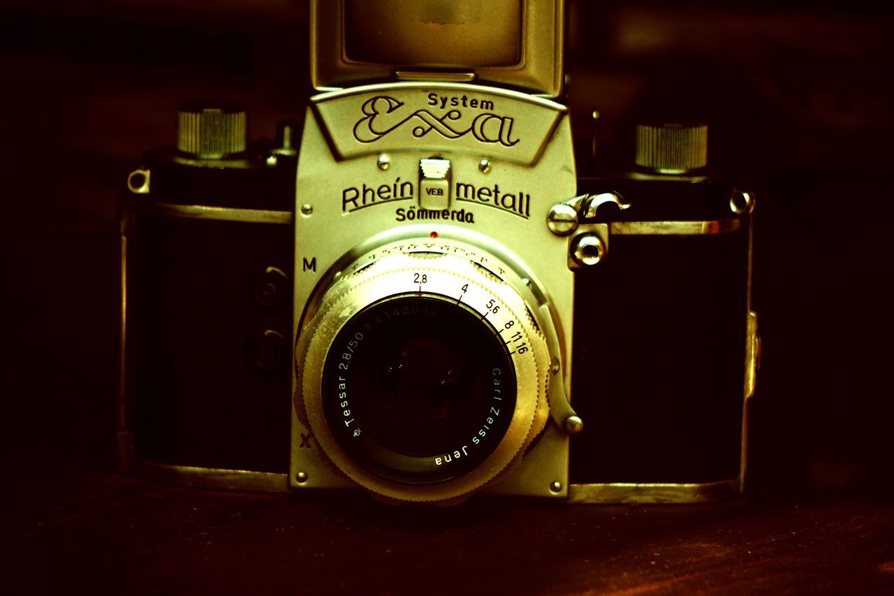 close-up, number, indoors, no people, still life, technology, text, retro styled, western script, old, camera - photographic equipment, communication, single object, photography themes, metal, photographic equipment, vintage, antique, yellow