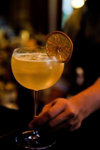 Close-up of hand holding wine glass