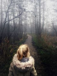 Woman with dog in forest