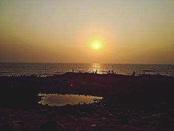 Scenic view of sea at sunset