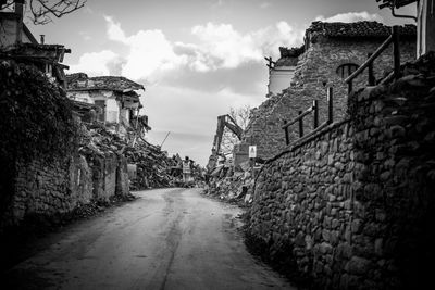 Street amidst buildings against sky