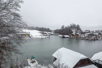 Scenic view of lake against sky during winter