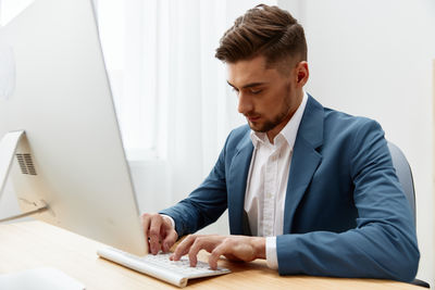 Businessman working at desk in office