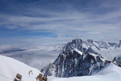 Scenic view of snowcapped mountains against sky