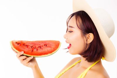 Portrait of young woman holding ice cream