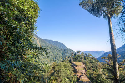 Scenic view of mountains against blue sky