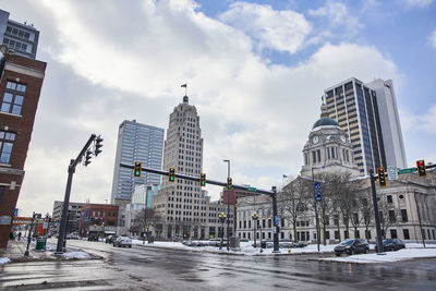 Modern buildings in city against sky