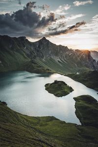 Scenic view of landscape against dramatic sky