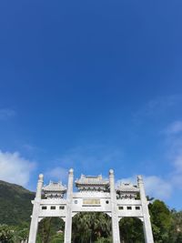 Low angle view of historical building against blue sky