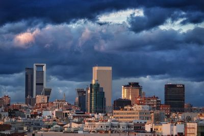 Modern buildings in city against sky