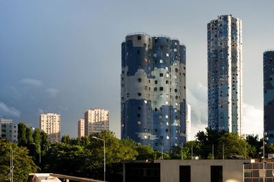 Low angle view of skyscrapers against sky