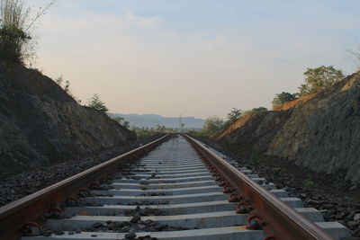 Surface level of railroad tracks against sky