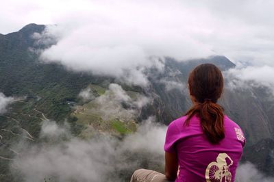 Rear view of woman looking at mountains