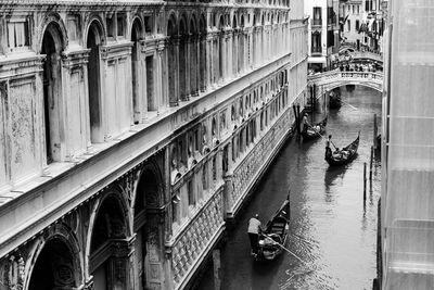 High angle view of people at canal in city