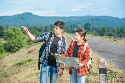 Friends standing on a land