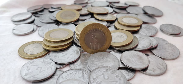 High angle view of coins on table