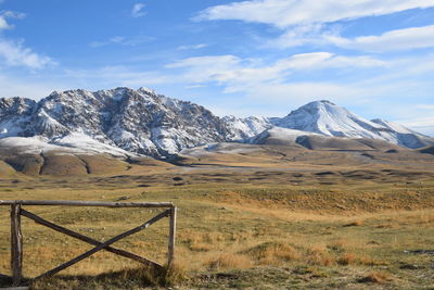 Scenic view of snowcapped mountains against sky