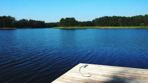 View of calm lake against clear sky