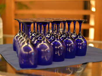 Close-up of drinking glasses arranged on table