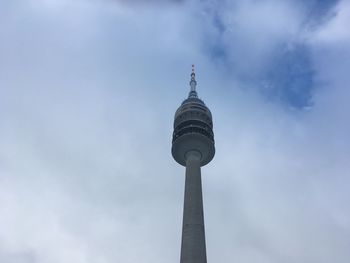 Low angle view of communications tower against sky