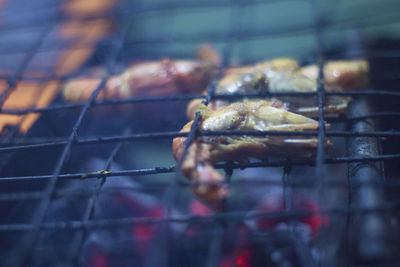 Close-up of meat on barbecue grill