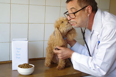 Close-up of man with dog